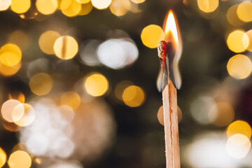 flash of feelings. Burning matches pair on yellow bokeh blurred background.Transience of time...