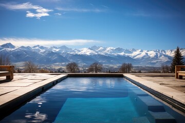 Fototapeta premium Pool overlooking snowy mountains