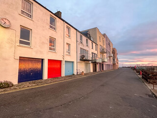 St Andrews, Scotland - September 22, 2023: Views of the buildings, vessels, breakwater and marina in St Andrews Scotland at sunrise
