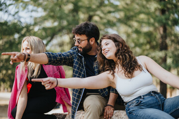 Carefree young adults having fun in a sunny city park, enjoying nature and each others company. Their cheerful expressions reflect the positive energy of their weekend activities.