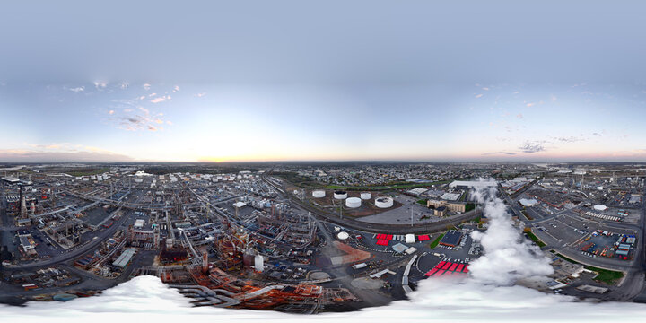 Aerial drone 360 panorama of an industrial oil refinery power plant with flue gas chimney smoke