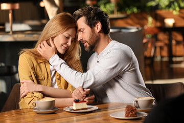 Romantic date. Lovely couple spending time together in cafe