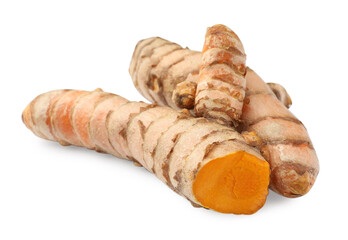 Whole and cut turmeric roots isolated on white