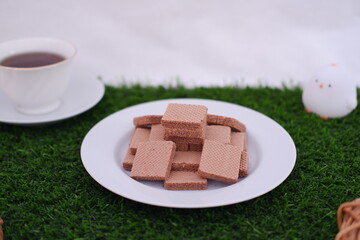 photo delicious wafers and a cup of coffee for breakfast, top view