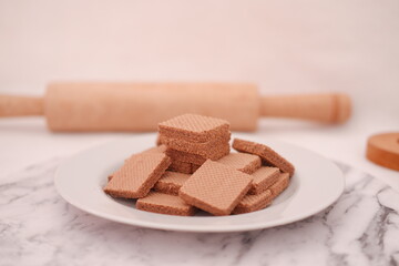 photo delicious wafers and a cup of coffee for breakfast, top view