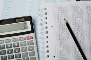 Calculator, notebook and pencil on document, top view
