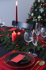 Elegant Christmas table setting with blank place cards and festive decor