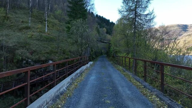 Crossing old railway bridge at Stavenes, decommissioned Bergen railway, Norway