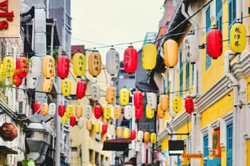 Foto op Plexiglas Chinese lanterns strung across colourful shopfronts in the alleyways of Kwai Chai Hong - Kuala Lumpur, Malaysia © Jina Ihm