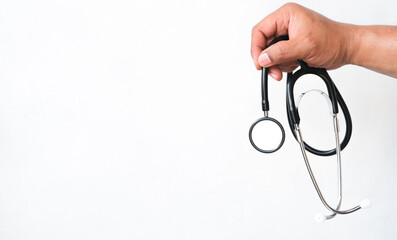 man's hand holding a stethoscope isolated white background