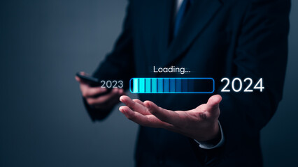 loading progress bar to 2024 Businessman using mobile phone investment and planning marketing finance and target growth success. - obrazy, fototapety, plakaty