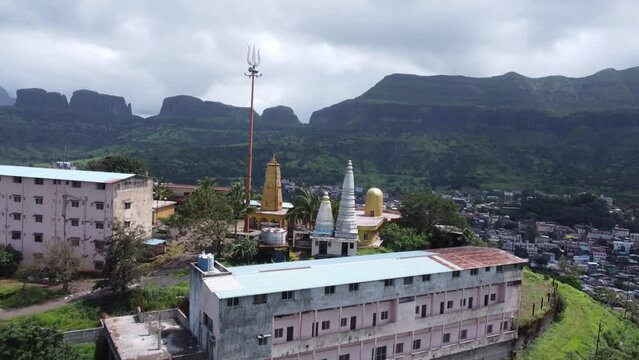 Panoramic aerial view of Nil Parvat sacred temple on the edges of Brahmagiri hills with the view of Trimbakeshwar town in the background, Nashik, Maharashtra, India