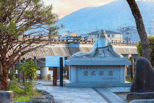 Kyoto, Japan - April 1 2023: Murasaki Shikibu statue at the Uji riverside, a Japanese novelist, poet and lady-in-waiting during Heian period, best known as the author of The Tale of Genji
