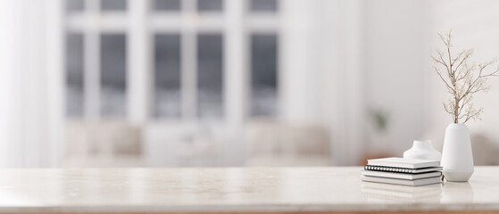 Copy space on a marble tabletop with a blurred background of a modern white living room.