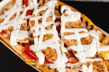 Gourmet grilled hot dogs with chicken, sauce and vegetables.Fresh tasty  Hot dogs