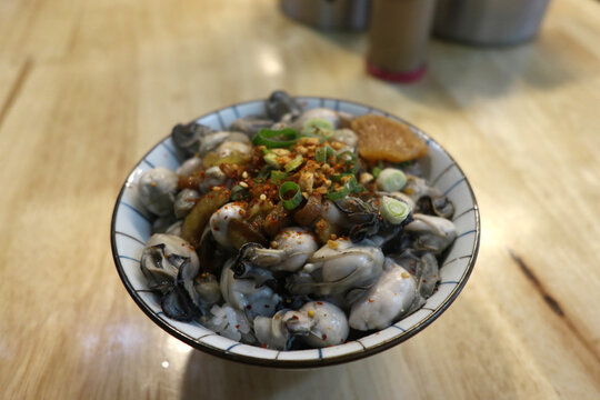 Fresh seafood rice bowl with oysters and cilli