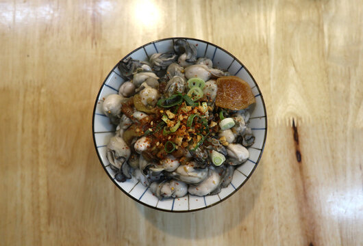 Fresh seafood rice bowl with oysters and cilli