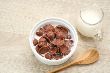 Bowl of cereal chocolate flavor, sweet crunchy 
