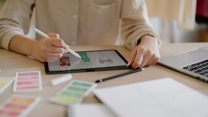 Curious young business woman working with documents in a workplace..