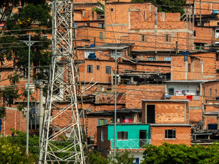 Electric tower and shacks in the favellas, a poor neighborhood in Sao Paulo, big city in brazil