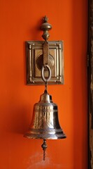 a bell on a wall - obrazy, fototapety, plakaty
