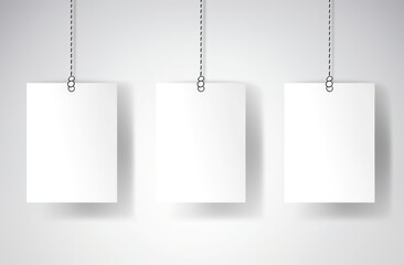 a group of white paper on a string