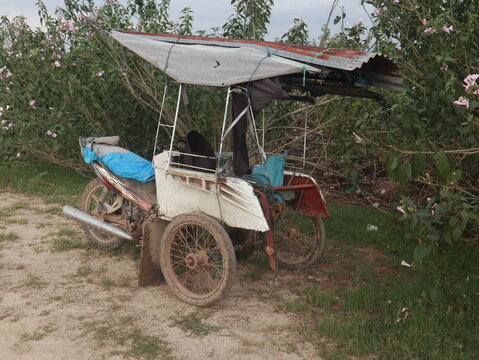 rusty bentor or motorbike rickshaws. Bentor is public transportation in Gorontalo province