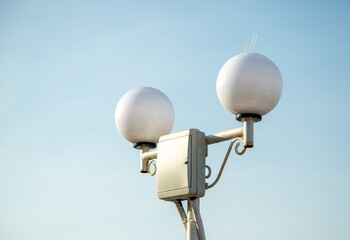 metal pipe, antenna, lamp, against the sky