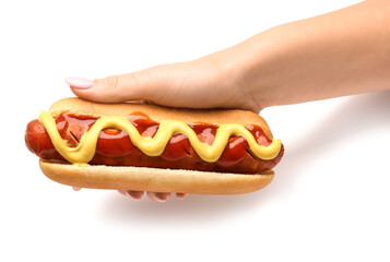 Woman holding tasty hot dog on white background