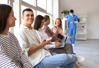 Patients waiting for their turn at hospital - obrazy, fototapety, plakaty