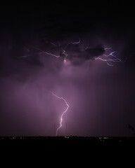Naklejka premium Strike of Lightning in the Purple Night Stormy Sky