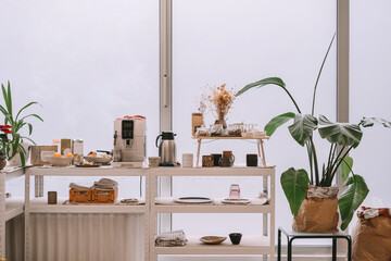 Pottery tablewares on shelves of small art shop.