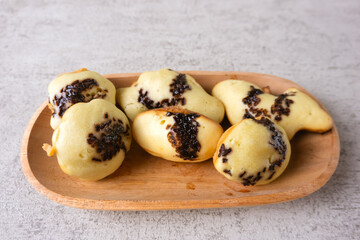 Kue cubit, a side snack from Jakarta, Indonesia. This cake got its name because the ripe cake was picked up with tongs by the seller, so it looked like it was being pinched.