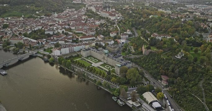 Prague Czechia Aerial v104 birds eye view, drone flyover Vltava river capturing historical landmark of Straka Academy, tilt up capturing panoramic cityscape - Shot with Mavic 3 Cine - November 2022