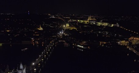 Prague Czechia Aerial v89 drone flyover Vltava river along Charles bridge towards Mala Strana capturing castle on the hilltop of Hradcany and night cityscape - Shot with Mavic 3 Cine - November 2022