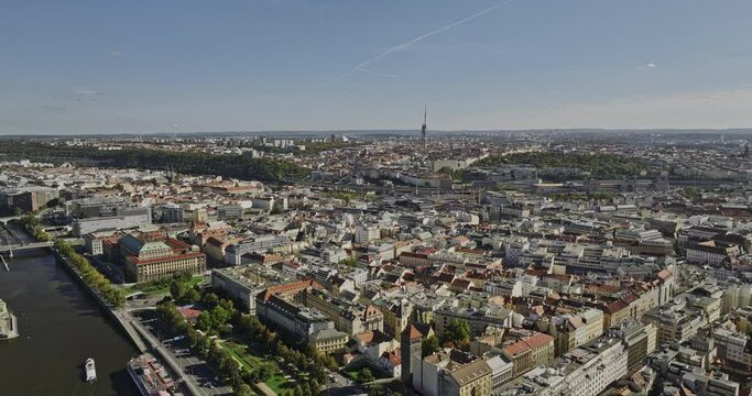 Prague Czechia Aerial v48 drone flyover Vltava river capturing cityscape across Karlin, Zizkov, Florenc, Vinohrady and New Town neighborhoods on a sunny day - Shot with Mavic 3 Cine - November 2022