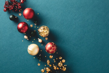 Elegant Christmas composition with balls, and festive decorations on a vintage teal background....