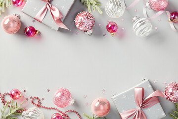 Christmas composition with elegant silver and pink elements. Festive flat lay design featuring...