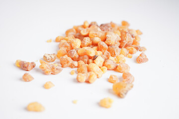 Frankincense or olibanum aromatic resin isolated on white background used in incense and perfumes.