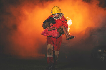 Firefighters bravely help fire victims out of the fire - obrazy, fototapety, plakaty