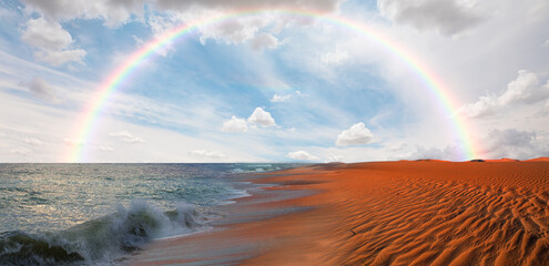 Namib desert with Atlantic ocean meets near Skeleton coast Amazing rainbow in the background -...