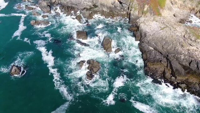 Drone video of waves hitting the rocky coastline in Bodega Bay and Gualala Coast, California, USA