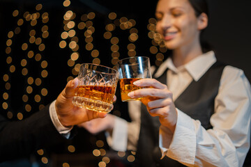 Barwoman pouring whiskey whiskey glass..