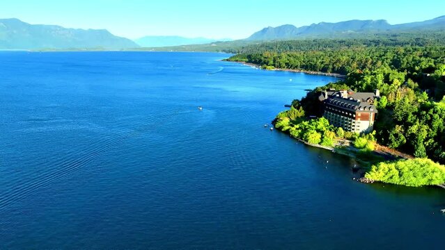Vibrant Colors Landscape over Villarrica Lake and Luxurious Hotel with Mountains, Chile