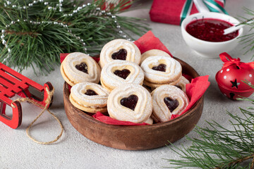 Christmas or New Years shortcrust cookies with red jam. Traditional festive Austrian cookies with jam