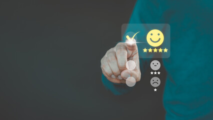 Male hand touching the virtual screen on happy smile face icon to give satisfaction in service....