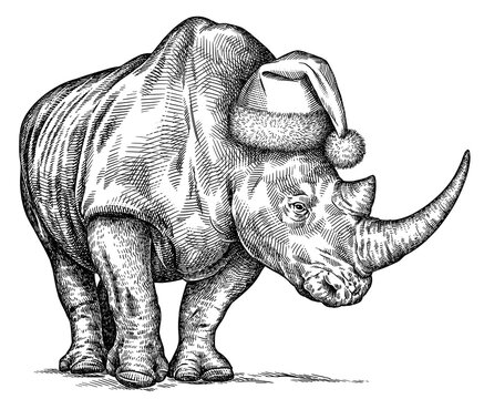 Vintage engraving isolated rhinoceros set  dressed christmas illustration ink santa costume sketch. Africa background rhino silhouette new year hat art. Black and white hand drawn image