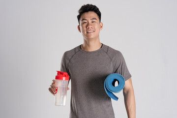 Image of Asian man exercising on white background