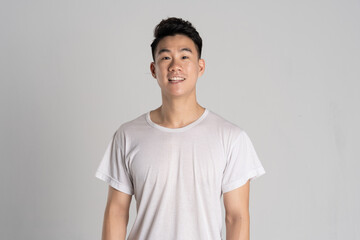 Portrait of Asian man posing on white background