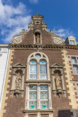 Facade with statues on a historic house in Roermond, Netherlands